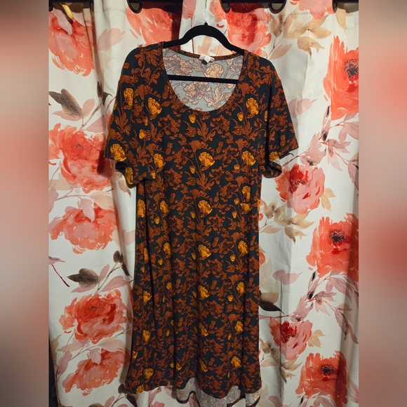 LuLaRoe Dresses & Skirts - LuLaRoe Black and Orange Floral Carly Dress